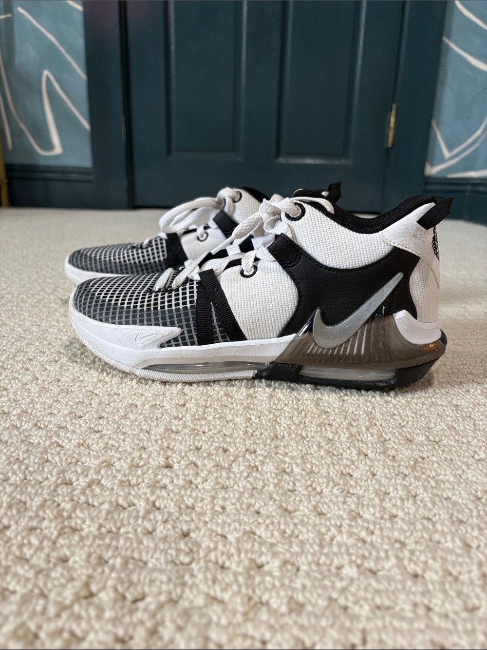 Nike Kids White and Black Sneakers with Silver Swoosh Accent